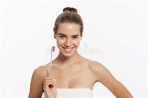 Beauty Portrait Of A Happy Beautiful Half Naked Woman Brushing Her Teeth With A Toothbrush And