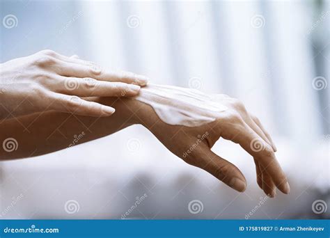 woman applying moisturizing cream on hands stock image image of cropped moisturizing 175819827