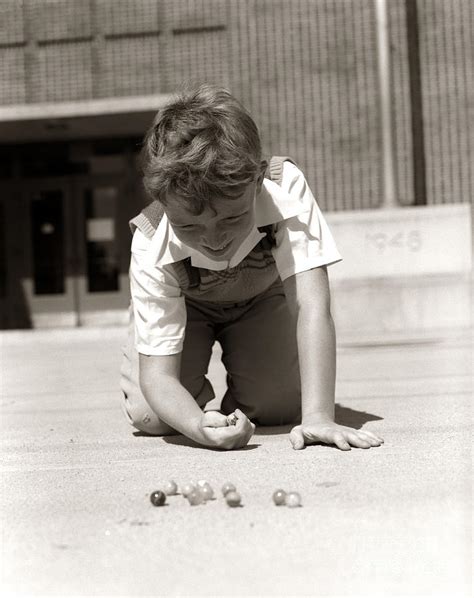 Boy Playing Marbles C1950s Photograph By H Armstrong Roberts