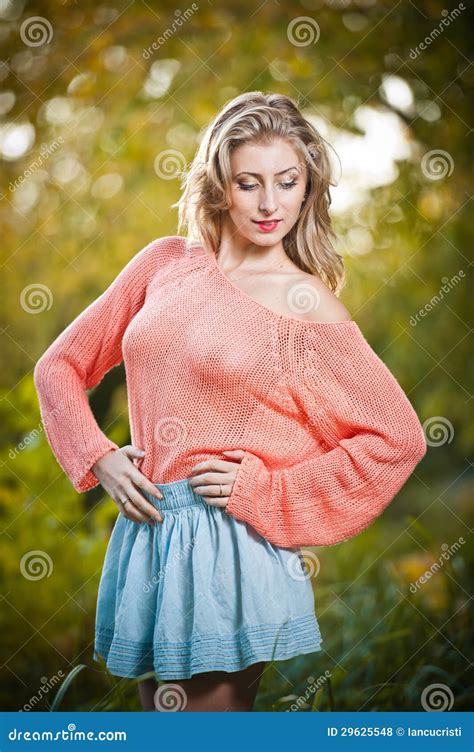 Beautiful Elegant Woman In Pink Sweater In Autumn Park Stock Photo
