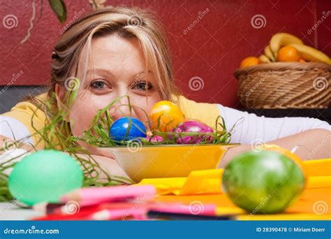 Young Woman Looking Over Colorful Easter Eggs Stock Photo Image Of