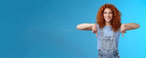 Charismatic Sassy Flirty Redhead Daring Ginger Girl Curly Haircut Pointing Down Index Fingers