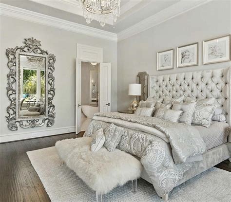 Luxury Romantic Bedroom With White Tufted Bed And Shipskin Bench
