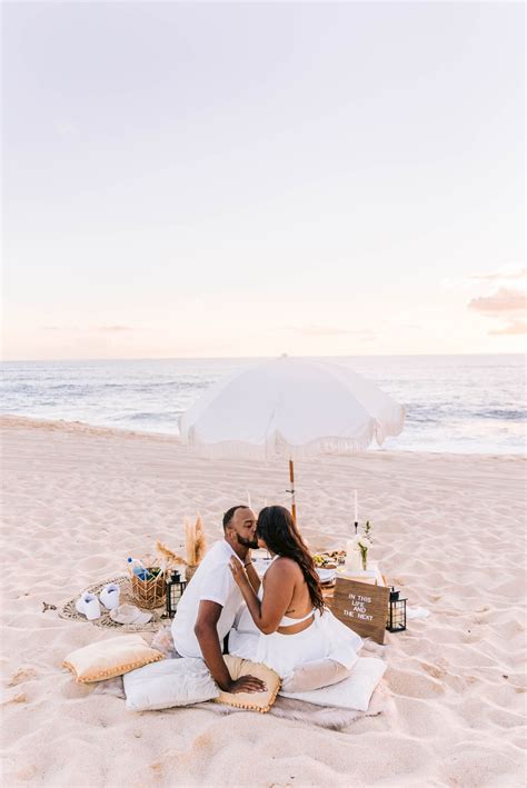 romantic oahu date night idea sunset picnic at the beach honolulu engagement photographer