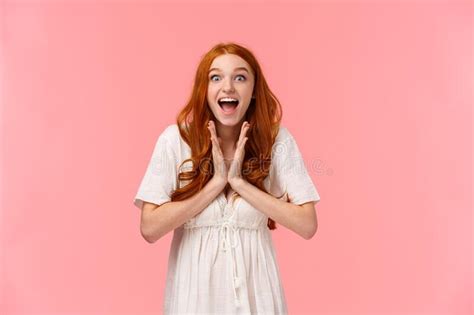 Fascinated Amused Lucky Redhead Female In White Dress Clap Hands