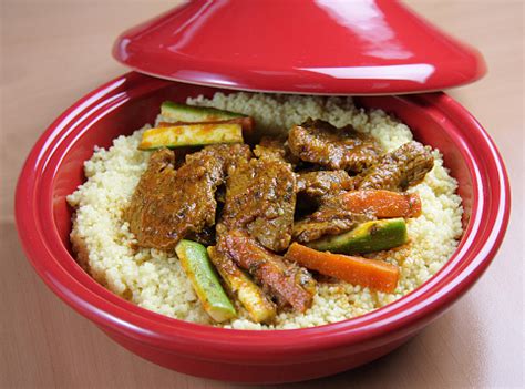 Making couscous in a tagine. Lamb With Couscous In Tajine Moroccan Dish Stock Photo ...