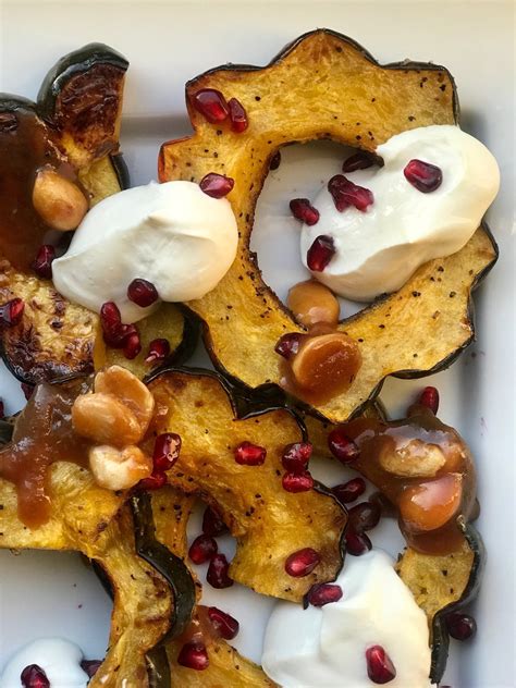 roasted acorn squash w labneh pomegranates and marcona almond caramel — eating fabulously x