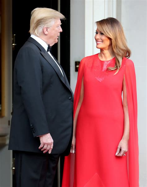 Melania Trump Stuns In Red Cape Sleeve Gown At Dinner During Uk State