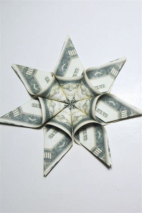 Easy tutorial on how to make a dollar origami star out of money. Image result for how to make an origami christmas tree ...