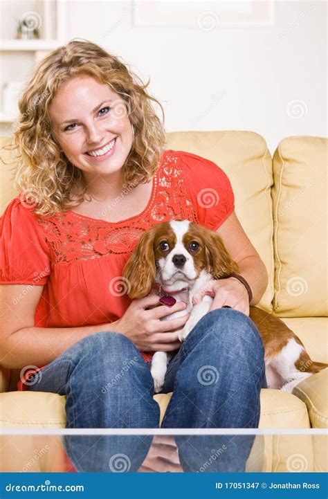 Woman Sitting On Sofa With Dog Stock Image Image 17051347