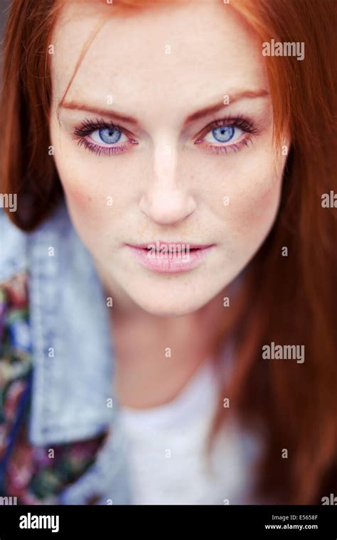 Portrait Of Young Woman Looking At Camera Stock Photo Alamy