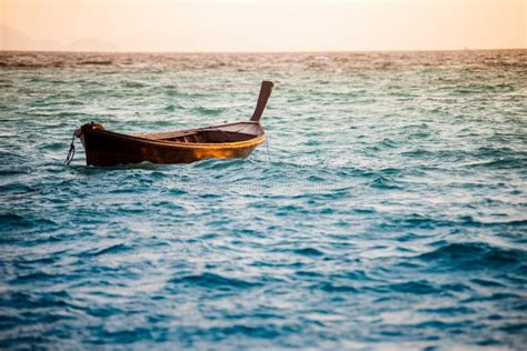 One Boat Floating In The Ocean Stock Photo Image Of Evening