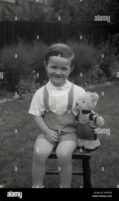 1950s Historical A Happy Young Boy Wearing A Pair Of Dungaree Shorts