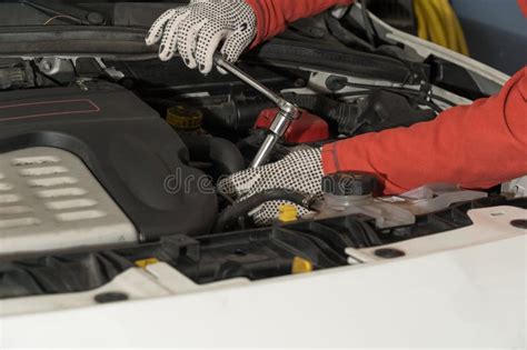 Closeup Shot Of A Mechanic Working On Vehicle Engines In A Mechanical