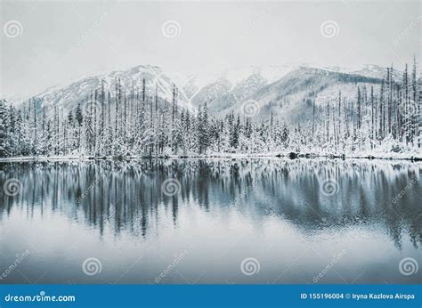 Panoramic View Of Beautiful Winter Lake With Snowy Mountain Peaks