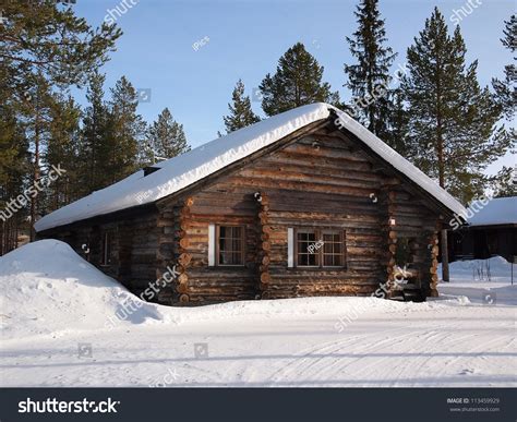 Romantic Snow Covered Log Cabin Between Stock Photo