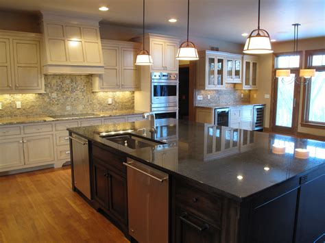 Remodeling your kitchen is a great investment for any homeowner. Extra large island in this beautiful kitchen design ...