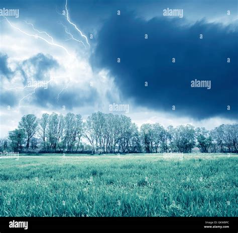 Green Field And Storm Stock Photo Alamy