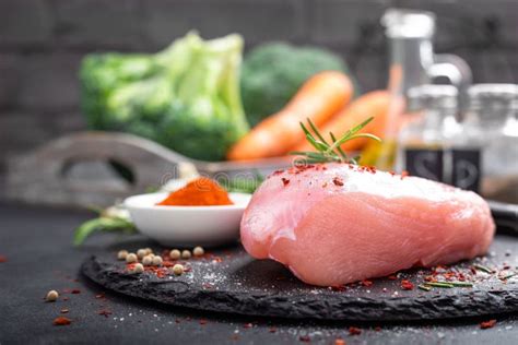 Fresh Raw Turkey Meat Fillet With Ingredients For Cooking On Board