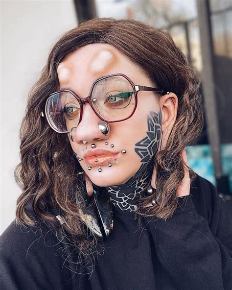 body modification fan with horn implants and face tattoos daily star