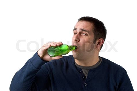 A Young Man Drinking A Bottle Of Beer Stock Image Colourbox
