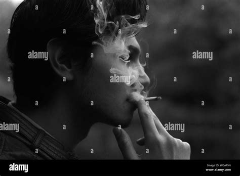 Side View Of Man Smoking Stock Photo Alamy