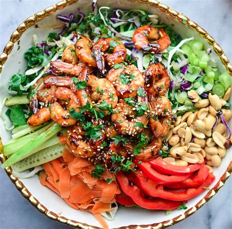 Shrimp, bell pepper, cucumber and herbs are tossed with a spicy thai dressing in this colorful salad. Thai Shrimp Salad w/ Peanut Dressing - Lace And Grace