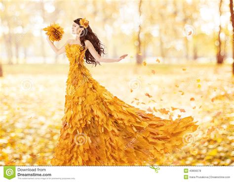 Autumn Woman In Fashion Dress Of Fall Maple Leaves Stock