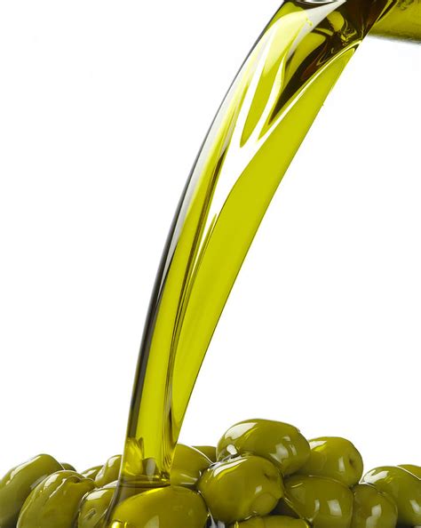 Olive Oil Pouring Over Green Olives By Domino