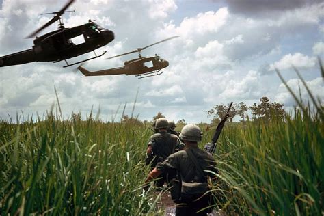 Uh 1 Hueys Landing To Pick Up American Infantry After A Search And Destroy Mission In The Mekong