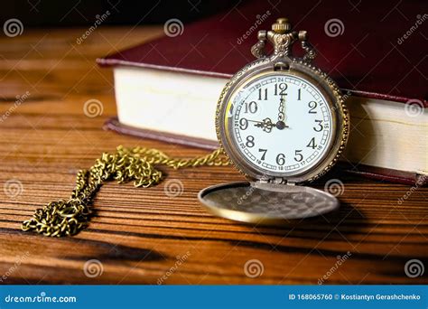 A Pocket Watch With Book Background Stock Photo Image Of Figures