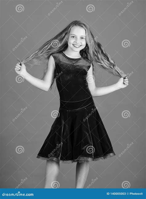 Kid Girl With Long Hair Wear Dress On Blue Background Hairstyle For