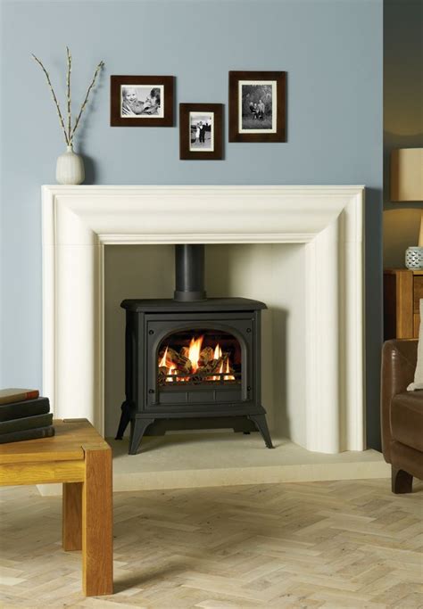 Burning gas fireplace in white yellow and blue flames isolated on black color inside a house fire in gas fireplace burns bright and warm on a cold and snowy winter day. Traditional Gas Stoves - Stovax & Gazco | Gas stove fireplace, Log burner living room, Fireplace