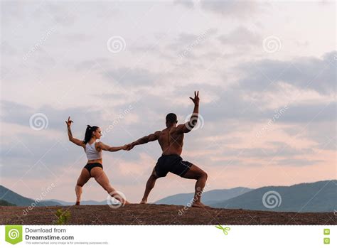 Mixed Race Gymnastic Couple With Perfect Bodies In Sportswear Dancing