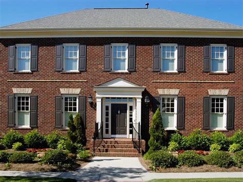 Colonial Brick House Exterior With Black Shutters