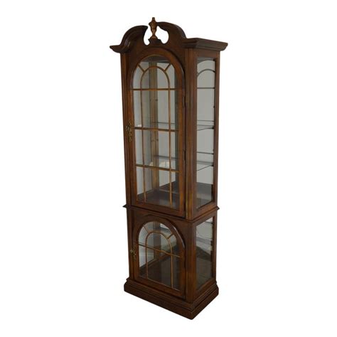 Curio cabinets feature glass panels on the sides and front doors which allows for a full view display. Traditional Cherry Narrow Curio Display Cabinet | Chairish
