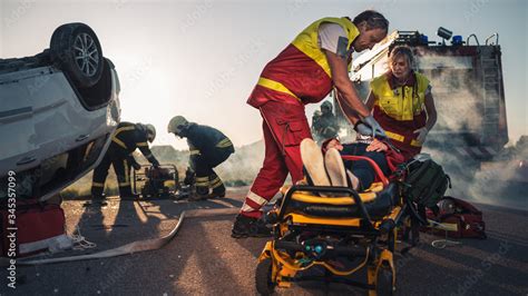 On The Car Crash Traffic Accident Scene Paramedics Saving Life Of A