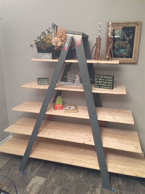 old wooden ladder transformed into a country chic shelf wooden ladder shelf diy ladder wood