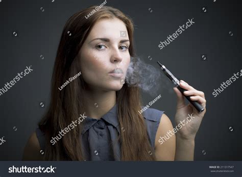 Elegant Woman Smoking Ecigarette Smoke Portrait Stock