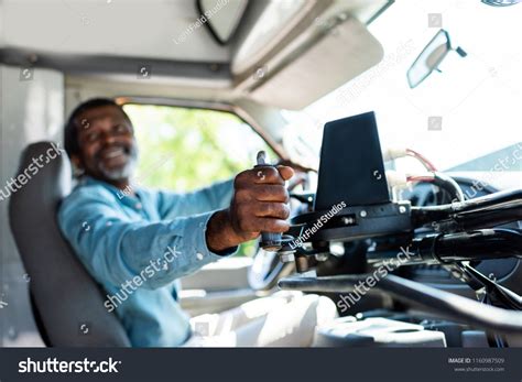 Mature African American Bus Driver Pulling Stock Photo 1160987509