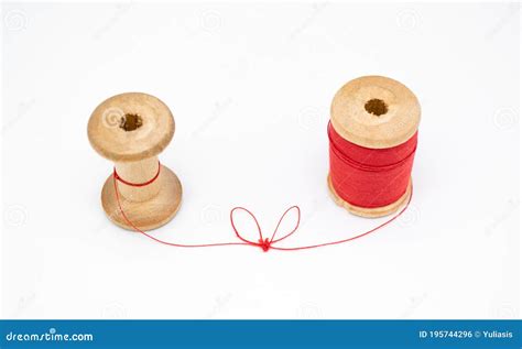 Two Wooden Spools Of Thread One Is Full The Other Almost Empty