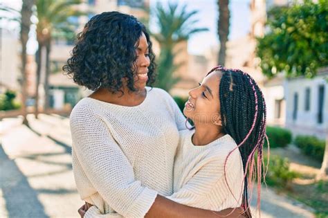 Beautiful African American Mother And Daughter Smiling Happy And Hugging Stock Image Image Of