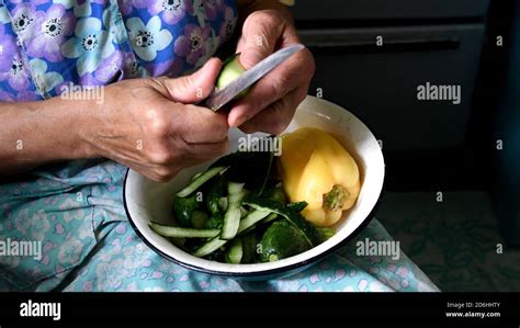 Granny Hands Cut Green Cucumber With Vintage Knife 80 Year Old Woman
