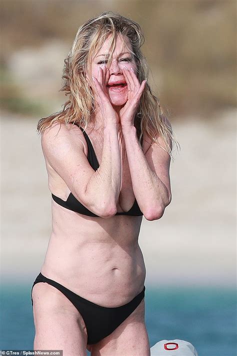 Melanie Griffith Dons Stylish Black Bikini As She Suns Herself Off The Coast Of Ibiza