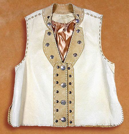 The sweet textured stripes and rose details make it extra special. free knitting pattern: women vest patterns 2012