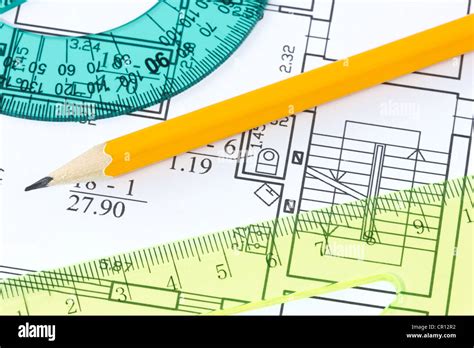 Scale Rulers And Pencil On Architectural Drawing Blueprint Stock Photo