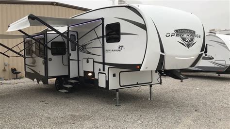 Rear bunk room with outdoor kitchen. The All New 2018 Open Range" Ultra Lite "Model 2910RL ...
