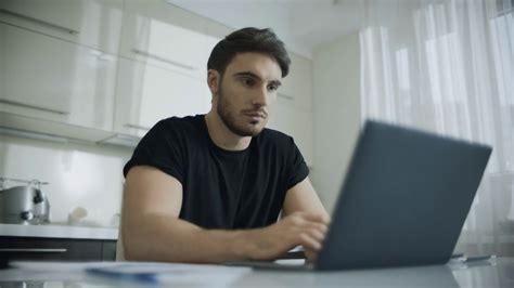 Man Using Laptop At Kitchen Table Stock Footage Sbv 333992895 Storyblocks