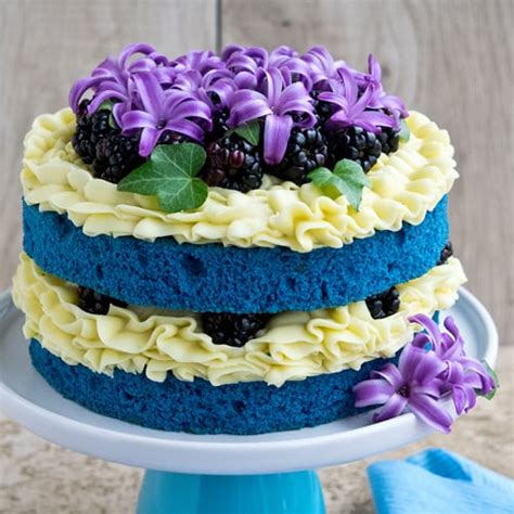 That rich red color is stunning and paired with a cream cheese frosting, you can't really go wrong. How To Make A Blue Velvet Naked Cake • CakeJournal.com