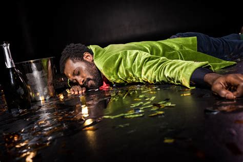 Selective Focus Of Drunk African American Man Lying On Floor With